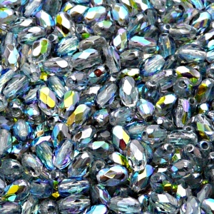 50ks České skleněné broušené tvarové ohňovky olivy 6x4mm čirá/ modrá duha
